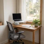 Tidy home office corner set up for remote work with a laptop and desk